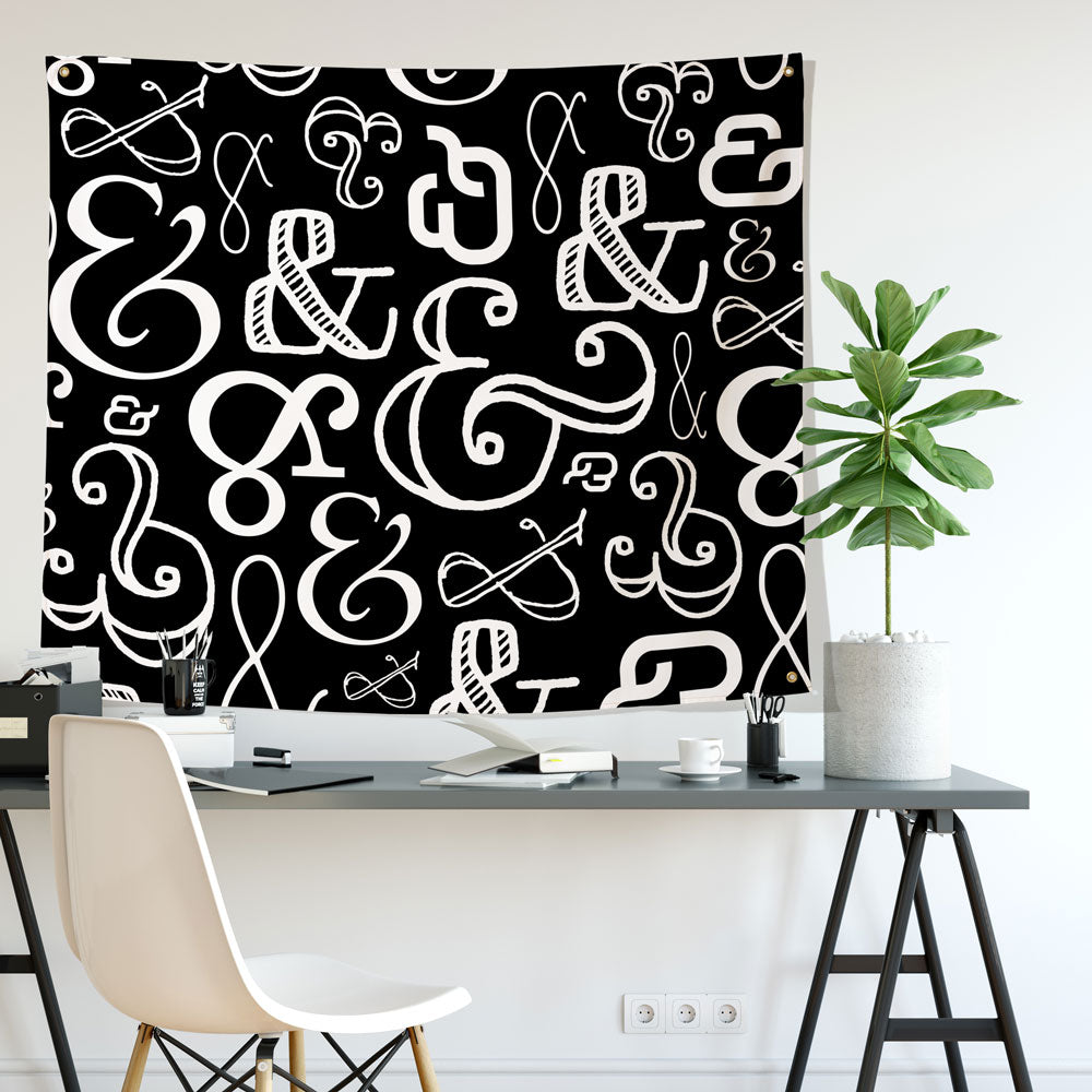 ampersand mostly black wall tapestry hung in an office